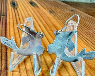 This lot features a pair of stunning vintage Taxco silver "fish" earrings with inlaid malachite.