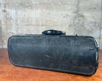 An antique Marceau brass trumpet and case in fair condition.