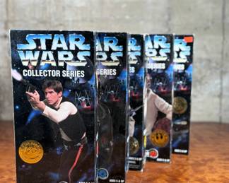 Five (5) Star Wars Collector Series action figures in their original packaging, featuring Han Solo, Greedo, Admiral Ackbar, and others. Each figure includes detailed outfits and accessories. Packaging shows minor wear consistent with age and storage.