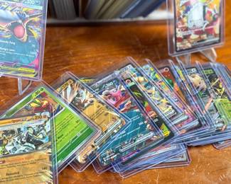 This lot features a large collection of Pokemon cards including both English & Japanese. Many holos and a good amount sleeved for protection.