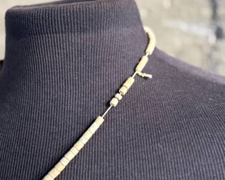 This lot features an antique Santo Domingo Pueblo (Kewa) Thunderbird necklace, an iconic style frequently made during the Depression era using repurposed materials like plastic from battery casings, phonograph records, and turquoise. This necklace has mosaic inlay typically utilizing turquoise, coral, and black jet (often repurposed plastic). These necklaces are highly collectible examples of Southwestern cultural heritage and resourcefulness. Handcrafted by artists from the Kewa (Santo Domingo) Pueblo, with many historic examples dating back to the 1920s–1940s. Measures, 22”.