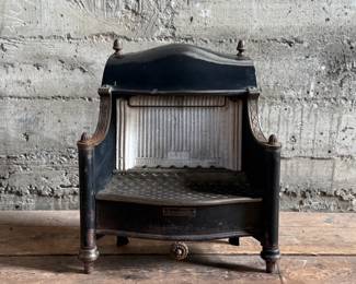 Humphrey Radiantfire No. 20 gas heater by the General Gas Light Co., Kalamazoo, MI. Crafted from cast iron, featuring intricate detailing and the signature model plate. Ornamental design with original patina and wear consistent with age. Includes decorative elements and vented grate. Ideal for collectors or display. Measures, 22” H x 19” W x 11” D.