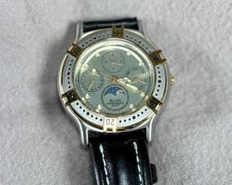 This lot features an Elgin FS-408 Calendar Moon Phase Quartz watch on a genuine leather band. Will need a new battery at minimum.