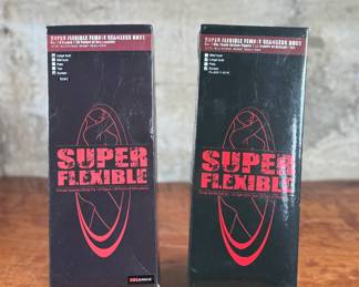 Two boxed Super Flexible Female Seamless Body figures designed for 1/6th scale action figures. Each features 28 points of articulation and a stainless steel skeleton. One box indicates “Med Bust, Pale, Suntan, ” while the other lists “Large Bust, Mid Bust, Tan, Suntan.” Both items are in original packaging with minor signs of handling on the boxes.