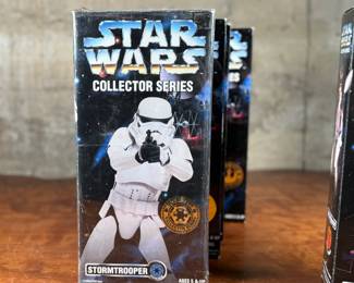Five (5) Star Wars Collector Series action figures in their original packaging, featuring Luke Skywalker, Princess Leia, Darth Vader, and others. Each figure includes detailed outfits and accessories. Packaging shows minor wear consistent with age and storage.