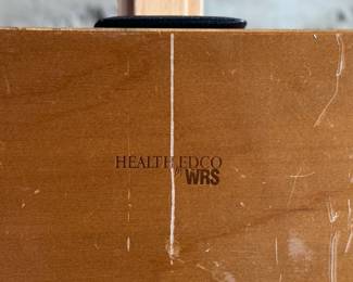 Wooden display case by Health Edco/WRS, containing educational models on the consequences of drug abuse. Case includes realistic anatomical representations of organ damage, such as brain infection, heart infection, vein damage, and birth defects. Accompanied by a ‘Substance Abuse Identification Guide’ and foam padding for storage. Case is equipped with clasps and a black handle. Exterior shows scratches and wear. Measures (closed), 27.75” H x 14” W.