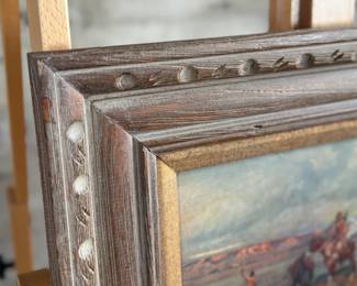 “Finding The Trail”, a professionally framed print by listed artist, C.M. Russell. Measures in frame, 18” H x 22” W.