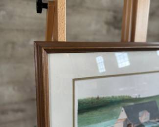 “Across the Meadow”, an original lithograph by listed artist, James Lynch. Signed lower right, professionally framed, and measures in frame, 22” H x 25.5” W. Certificate of authenticity on the verso. James Lynch (b. 1956) grew up in Wiltshire and now lives and works in Somerset. His work is included in the National Trust collections at Kingston Lacy, Wimpole Hall, and Chartwell. Awards include; the Elizabeth Greenshields bursary (83′), the Royal Academy Award for watercolour (86′) and the Spectator Art Award (93′).