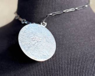 This lot features a vintage sterling silver necklace and pendant with inlaid malachite in excellent condition. Measures, 17” with a total approx. weight of 39.25 grams.