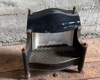 Humphrey Radiantfire No. 20 gas heater by the General Gas Light Co., Kalamazoo, MI. Crafted from cast iron, featuring intricate detailing and the signature model plate. Ornamental design with original patina and wear consistent with age. Includes decorative elements and vented grate. Ideal for collectors or display. Measures, 22” H x 19” W x 11” D.