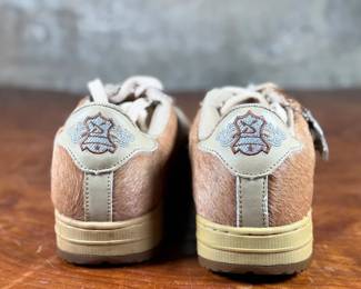 This lot features a pair of sneakers by Evolution we have titled, “Chewbacca” with fur-like texture on the sides. Some wear on the tongue, but in like-new condition otherwise. Highly collectible and come in a size men’s 10.