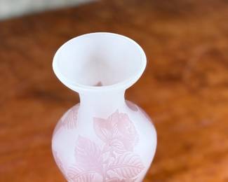 This lot features an Art Nouveau style cameo glass vase, featuring etched floral patterns in a purple or amethyst hue and measures, 10.5” H. Likely circa 1950s.