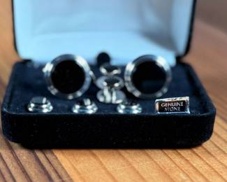 This lot features a Jonathan Wachtel onyx and silver cufflink and stud set, perfect for formal occasions.