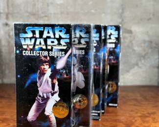 Five (5) Star Wars Collector Series action figures in their original packaging, featuring Luke Skywalker, Princess Leia, Darth Vader, and others. Each figure includes detailed outfits and accessories. Packaging shows minor wear consistent with age and storage.