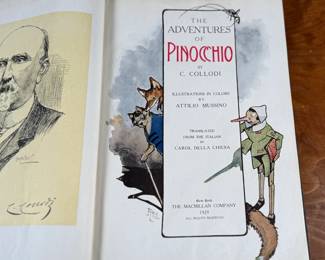 The Adventures of Pinocchio by C. Collodi, printed in Italy by R. Bemporad & Son. This is the third printing of the edition in English text, featuring illustrations in color by Attilio Mussino. Hardcover with a dark blue cover, red spine lettering, and a prominent illustrated design. Published in 1929 by The Macmillan Company. Includes vivid illustrations and period typography.