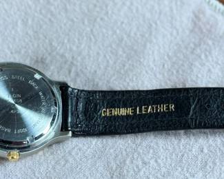 This lot features an Elgin FS-408 Calendar Moon Phase Quartz watch on a genuine leather band. Will need a new battery at minimum.