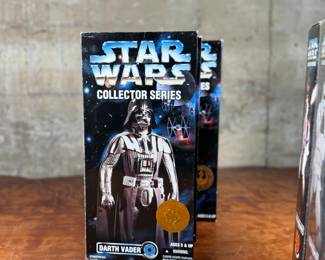 Five (5) Star Wars Collector Series action figures in their original packaging, featuring Luke Skywalker, Princess Leia, Darth Vader, and others. Each figure includes detailed outfits and accessories. Packaging shows minor wear consistent with age and storage.