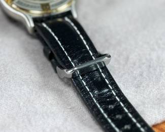 This lot features an Elgin FS-408 Calendar Moon Phase Quartz watch on a genuine leather band. Will need a new battery at minimum.