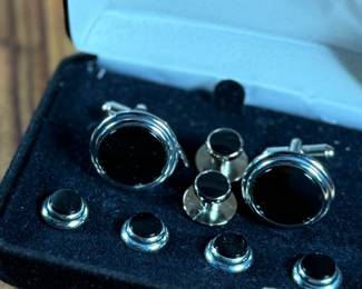 This lot features a Jonathan Wachtel onyx and silver cufflink and stud set, perfect for formal occasions.