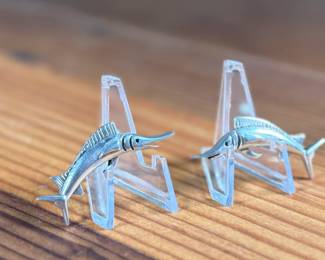 This lot features a pair of vintage sterling silver earrings depicting swordfish.