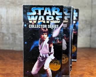 Five (5) Star Wars Collector Series action figures in their original packaging, featuring Luke Skywalker, Princess Leia, Darth Vader, and others. Each figure includes detailed outfits and accessories. Packaging shows minor wear consistent with age and storage.