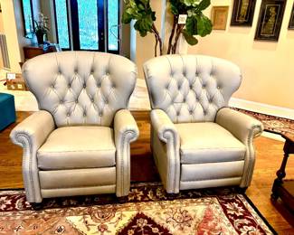 Exceptional pair of tufted leather recliners
