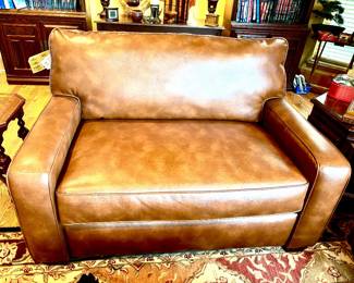 Pair of leather look sleeper love seats