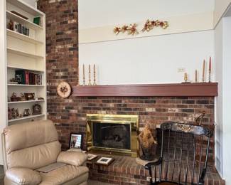 Rocking Chair, Leather recliner, books, brass candlesticks