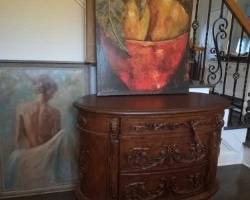 credenza with two of the many art pieces