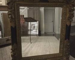 Gorgeous antique flourished frame with inserted beveled glass mirror