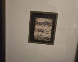 Music score in large matted picture
