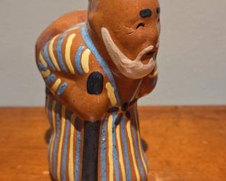 Ceramic Figurine of a Man Carrying a Bundle  Possibly Uzbek Folk Art