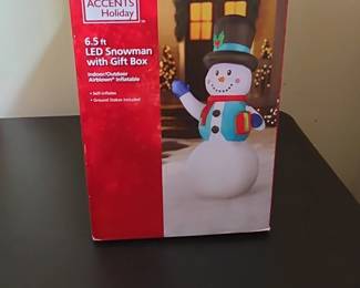Home Accents Holiday . ft LED Snowman with Gift Box Inflatable