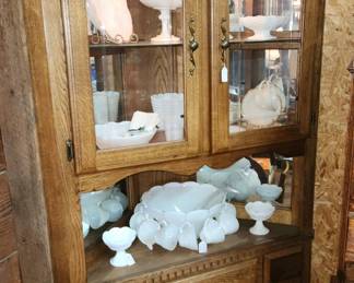 Lighted corner cupboard with milkglass