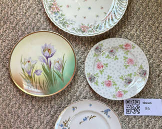 Lot 86: Four Decorative Floral Porcelain Plates