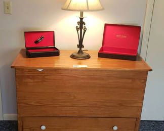 Lot 94: Wooden Storage Chest with Hinged Lid and Drawer, with decorative lamp.