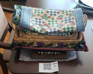 Lot 59: Decorative Baskets, Wooden Tray, and Assorted Fabric Placemats