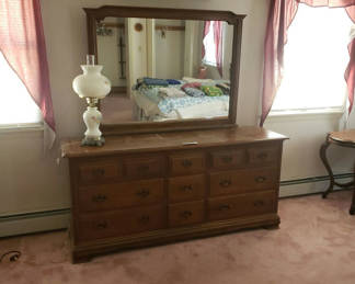 Lot 98: Wooden dresser with mirror and table lamp