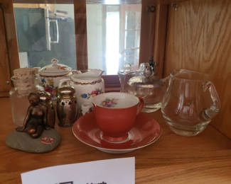 Lot 42: Floral teapot set with creamer and sugar pot, glassware, and figurine