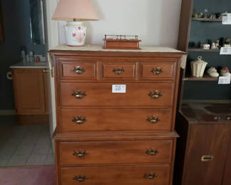 Lot 99: Tall wooden dresser with lamp and vintage jewelry box