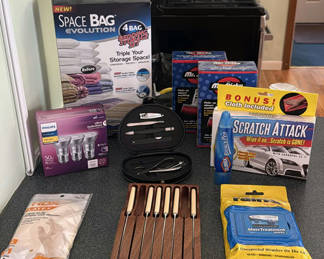 Lot 32: Assorted Household Items Including Knife Set, Glass Mugs, Storage Bags, and Cleaning Supplies