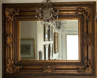 56" W X 44" T Heavily framed beveled mirror
