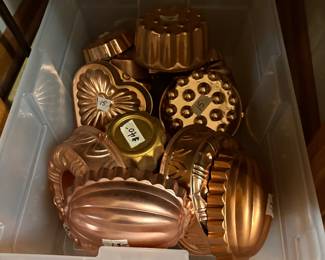 Kitchen- in closet at bottom - copper molds in various sizes and shapes