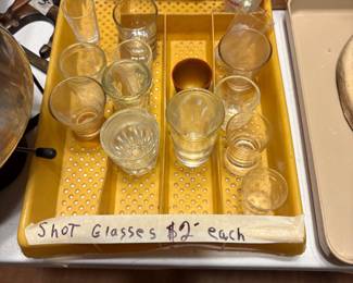 Shot glasses in various sizes in silverware caddy - kitchen