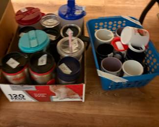 Under table in kitchen - various drink ware and more coffee cups