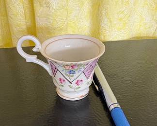 Porcelain Teacup with Floral Motif and Geometric Band