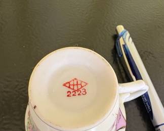 Porcelain Teacup with Floral Motif and Geometric Band