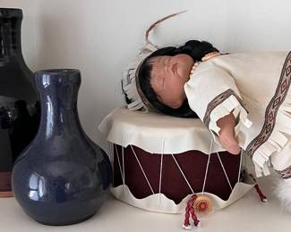 Pottery, "Little Willie" Native American Doll resting on a Drum