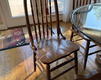 	#24	Oak Table with 4 chairs and glass top 35x29	 $125.00 				