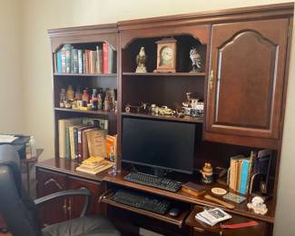 Dell Monitor, Bookcase and Computer unit.